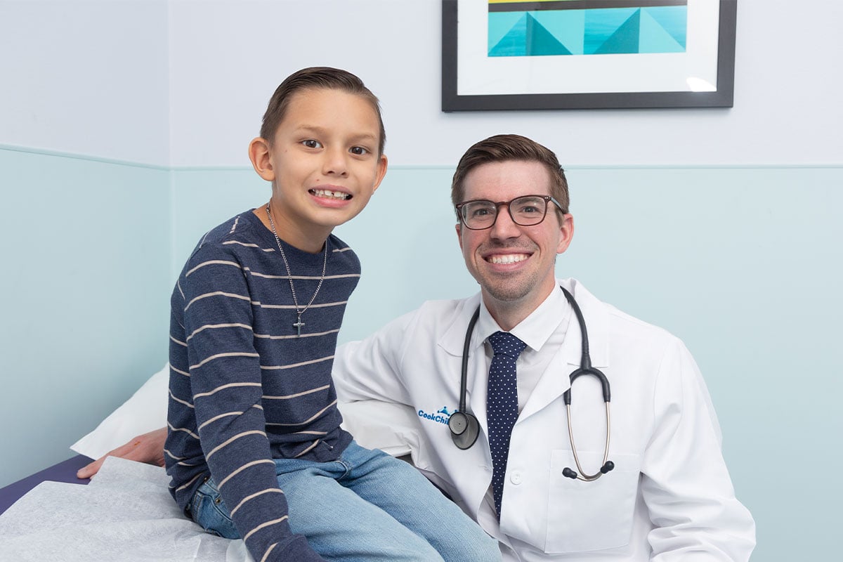 Primary care physician examining a child at a pediatric office in Anna, Texas