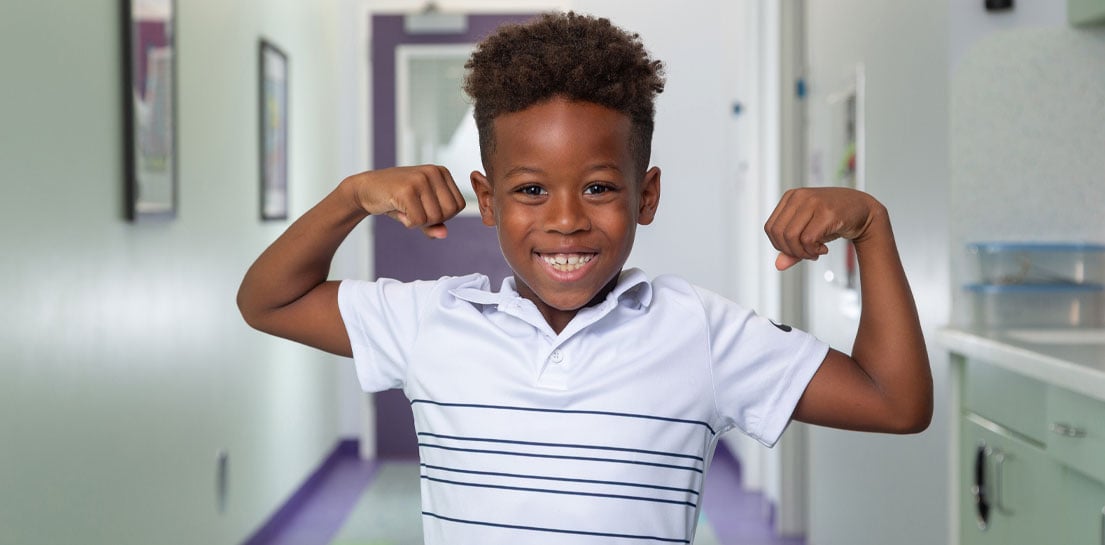 Boy using superman pose