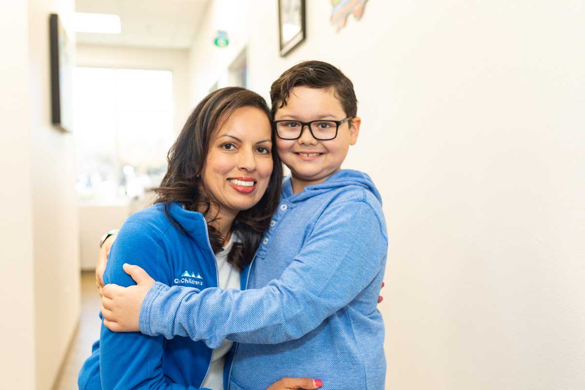 Dr. Bhavana Babber hugging boy