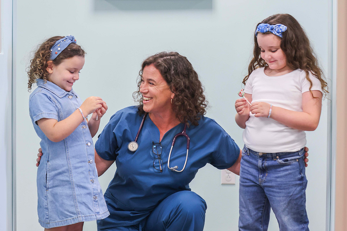 Nurse with two girl patients