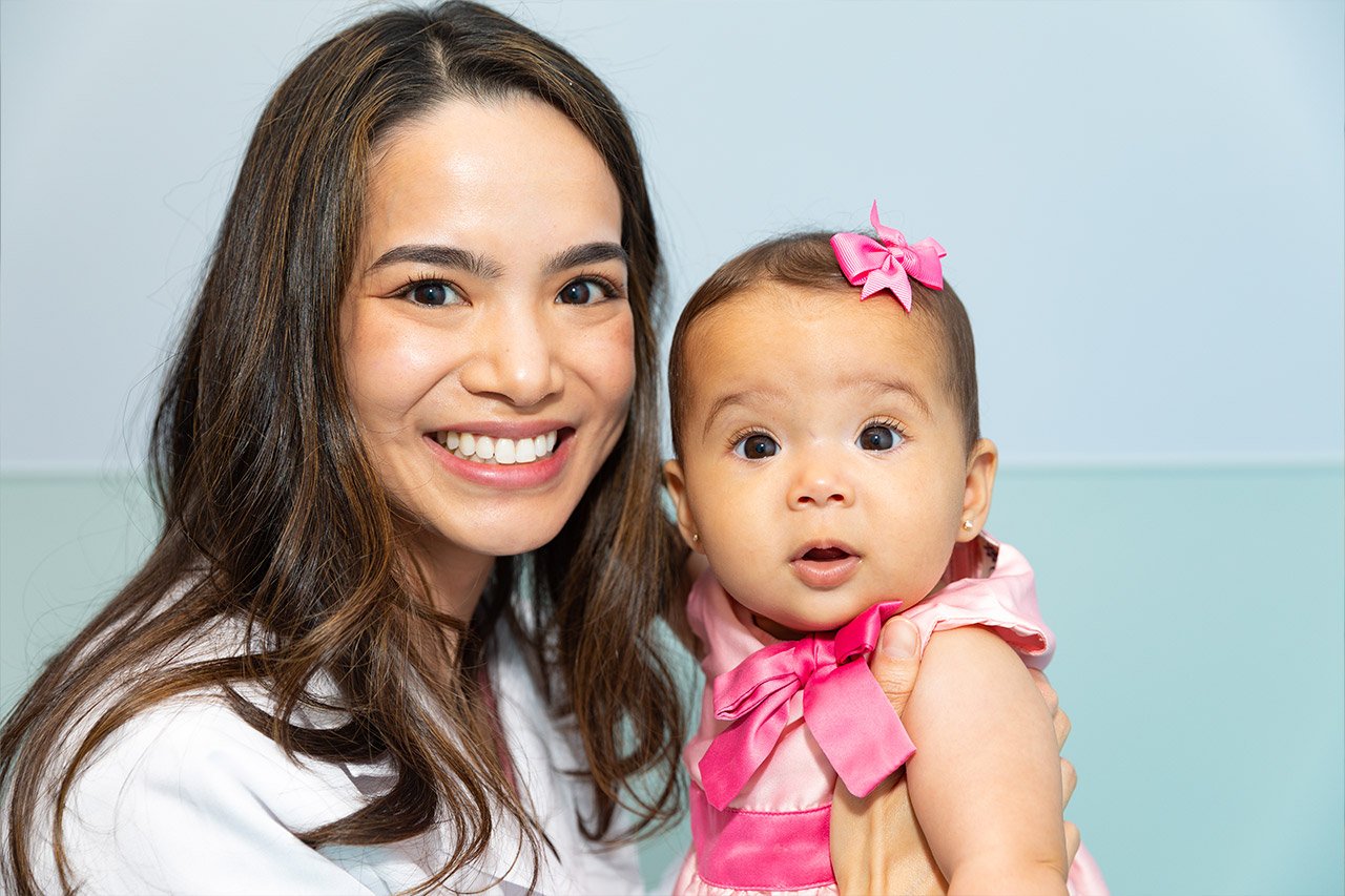 Dr. Courtney Tran caring for young girl